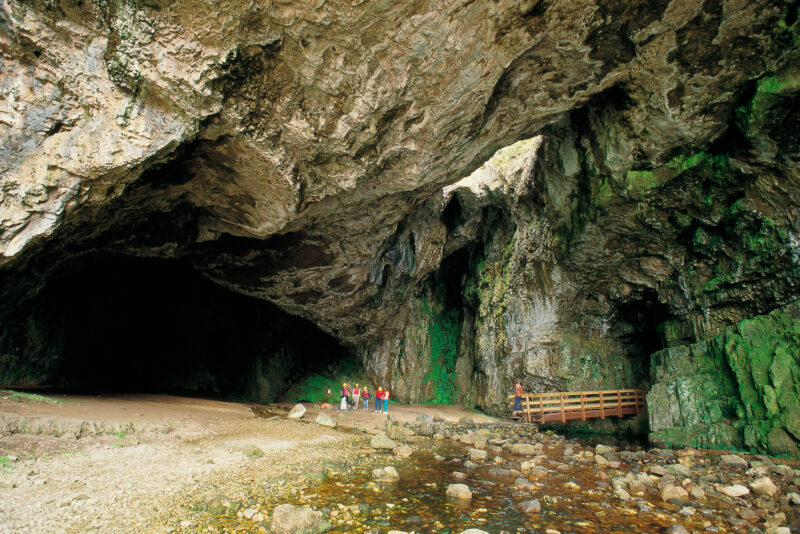 Looking Over To A Group Of People Preparing To Enter Smoo Cave